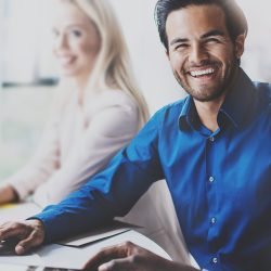Portrait,Of,Successful,Hispanic,Businessman,Smiling,On,The,Business,Meeting